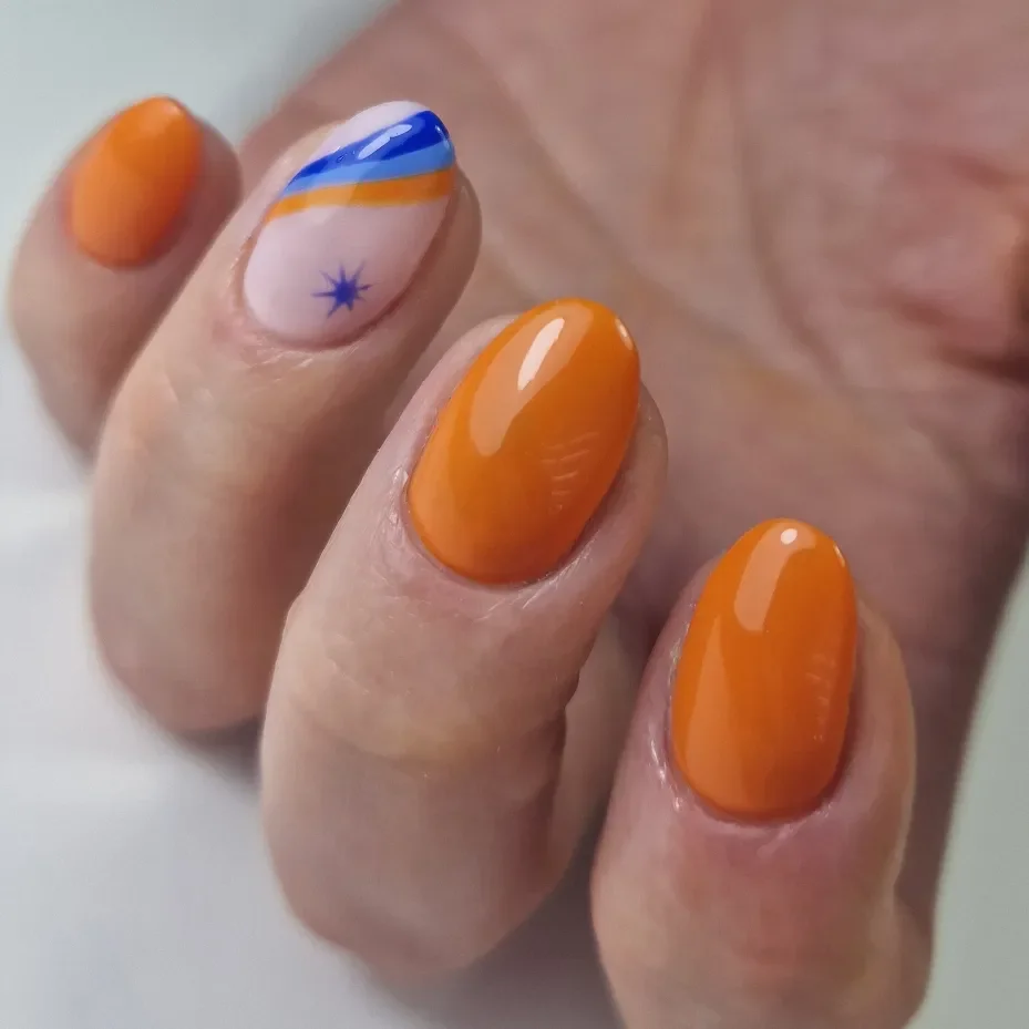 summer oval nails 2026 Bright Orange Oval Nails With Blue Graphic Accent Art