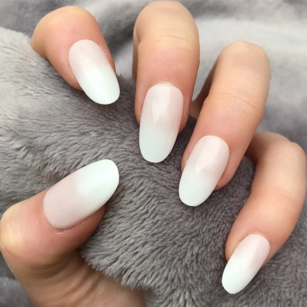 summer oval nails 2026 Soft White Ombre Oval Nails With A Milky Glow