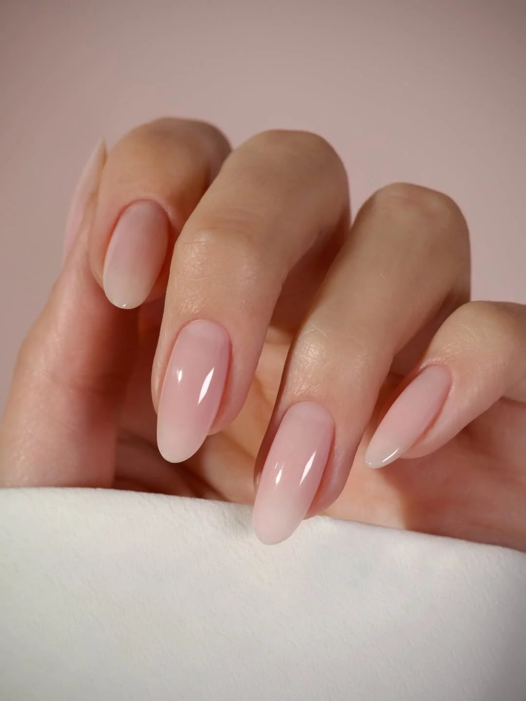 summer oval nails 2026 Sheer Pink Long Oval Nails With A Glassy Finish