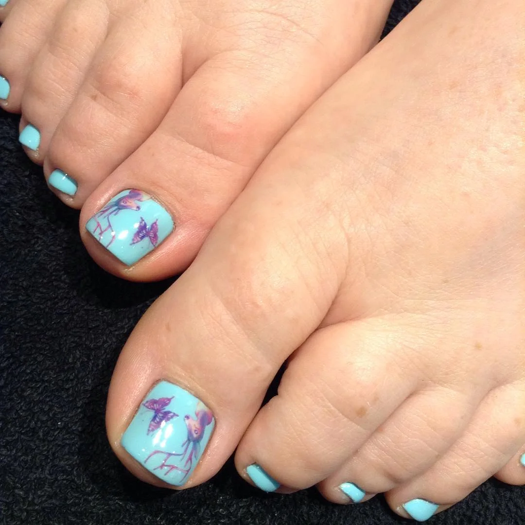 summer pedicure nail art 2026 Aqua Pedicure With Purple Tropical Flower Art