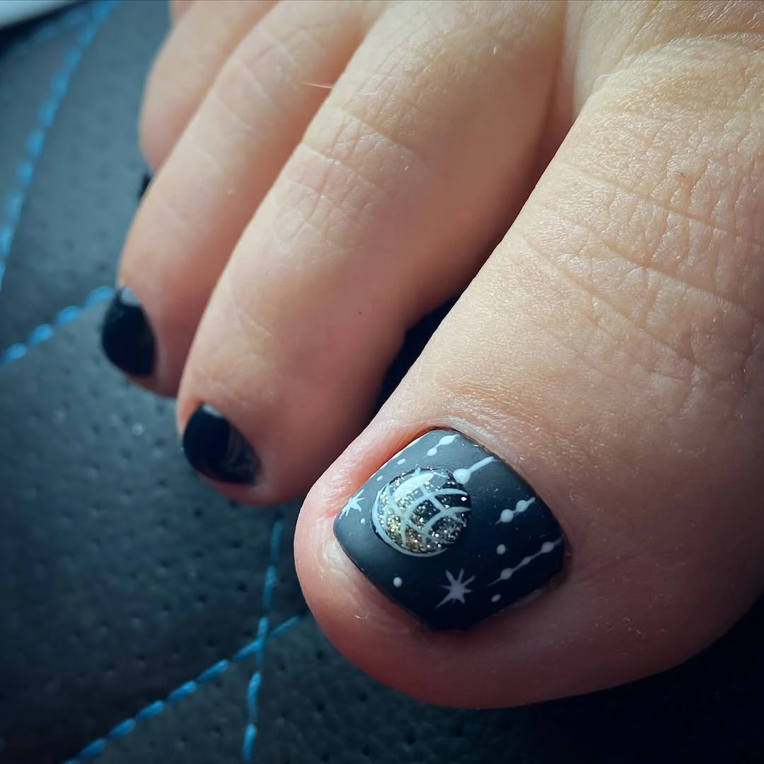 summer pedicure nail art 2026 Black Cosmic Pedicure With Silver Star Details