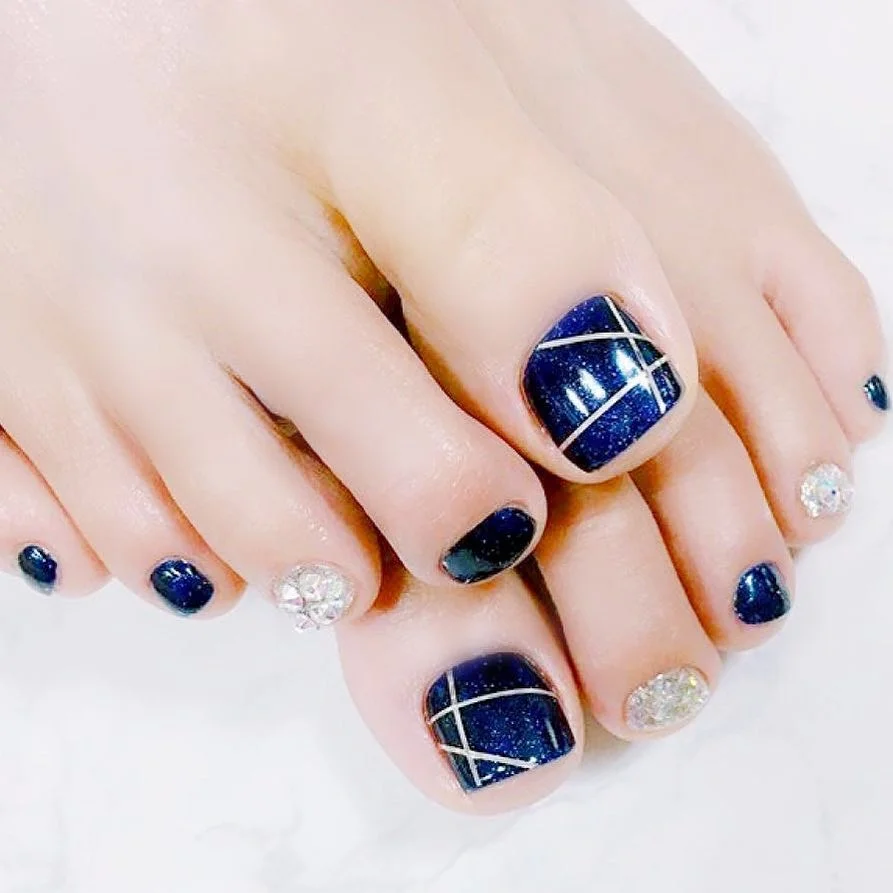 summer pedicure nail art 2026 Navy Glitter Pedicure With Silver Line Art