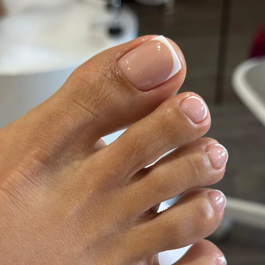 summer toe nails design ideas 2026 Minimal Nude French Pedicure With Soft White Edges