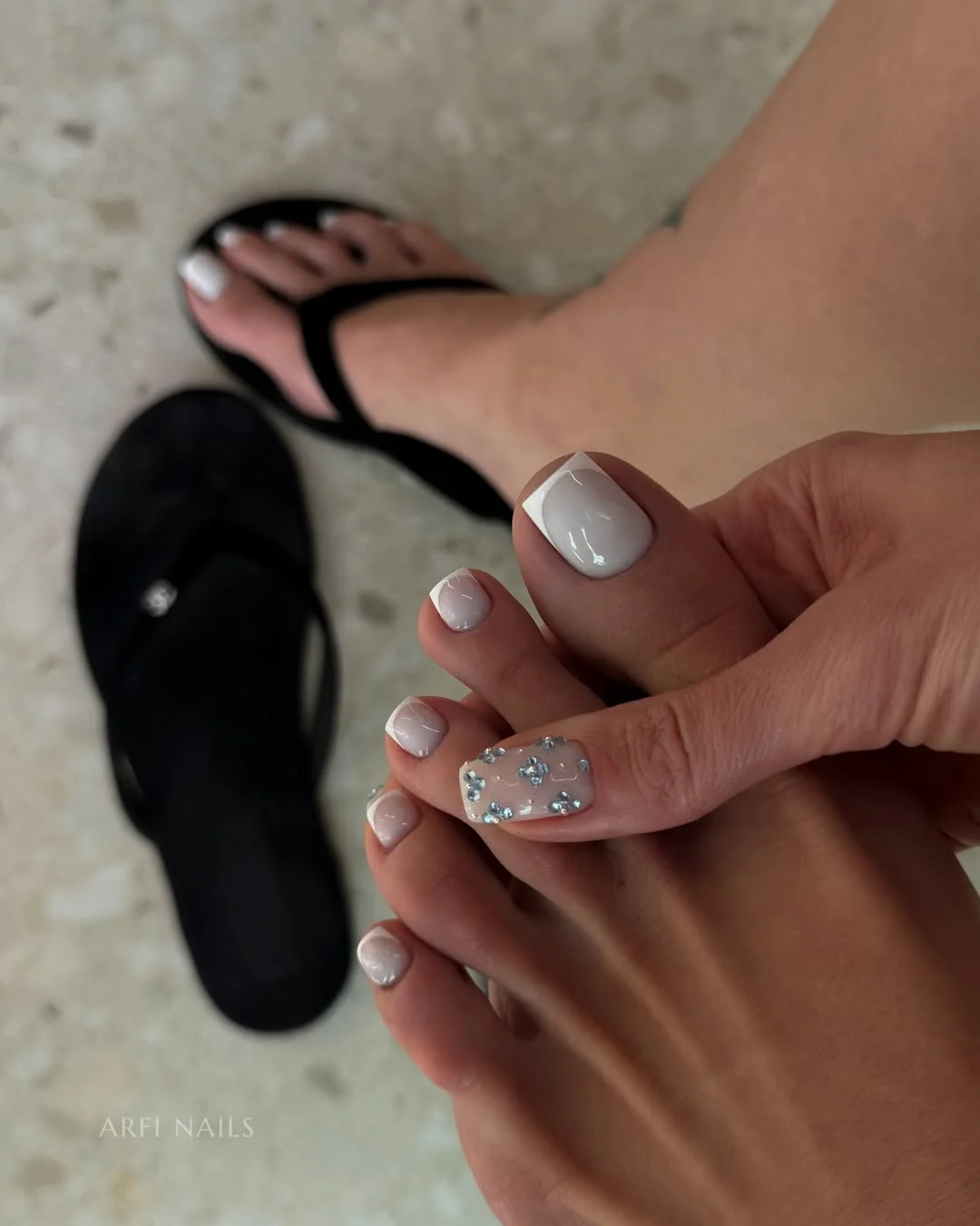 summer toe nails design ideas 2026 Milky White French Pedicure With Silver Floral Sparkle